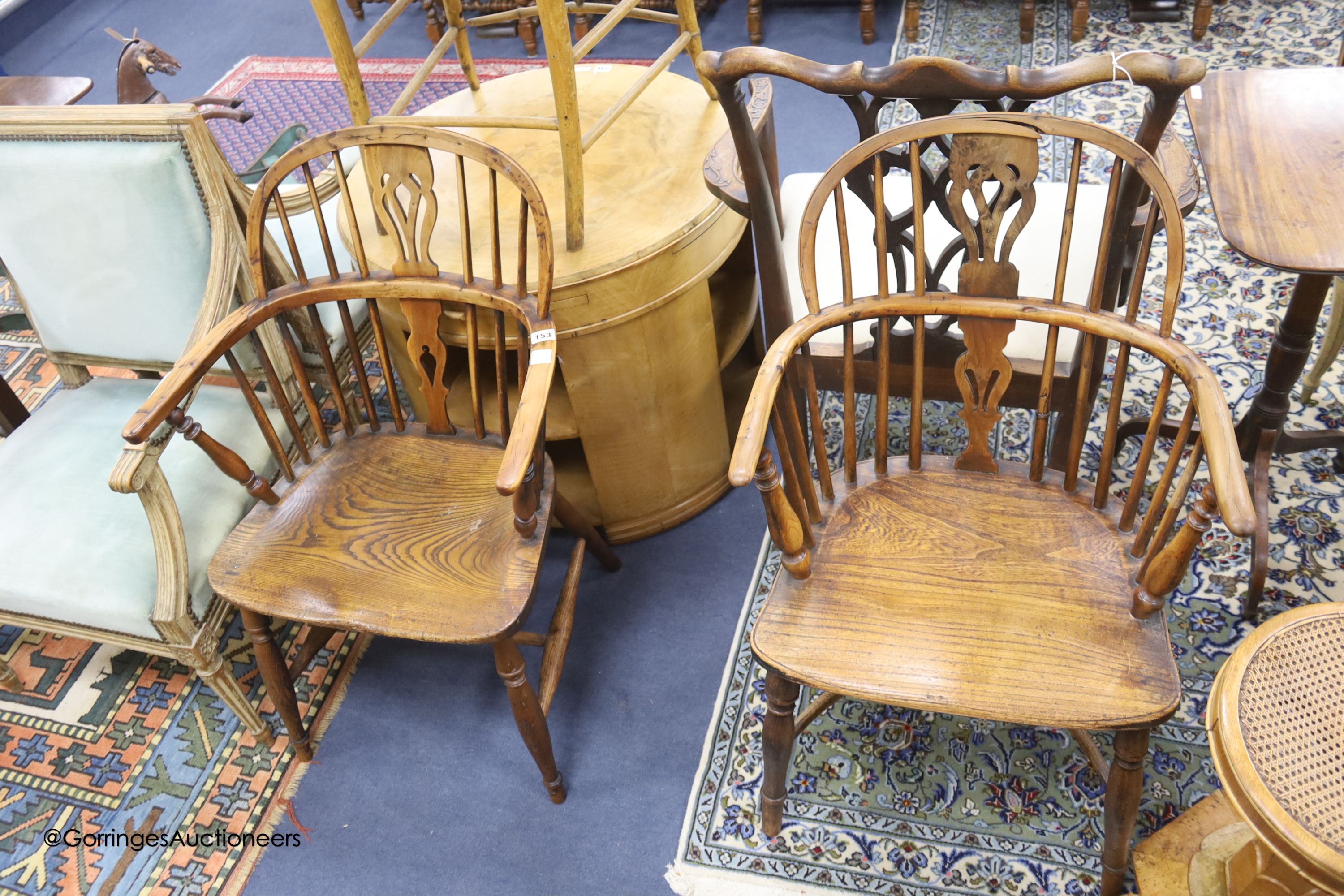 A pair of early 19th century Windsor yew and elm elbow chairs